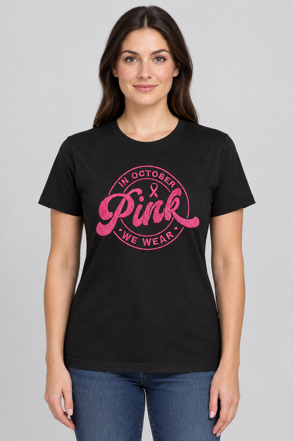 Woman wearing a black T-shirt with the pink awareness design against a light-gray background