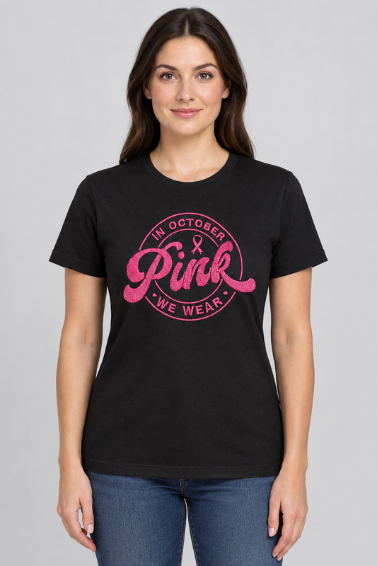 Woman wearing a black T-shirt with the pink awareness design against a light-gray background